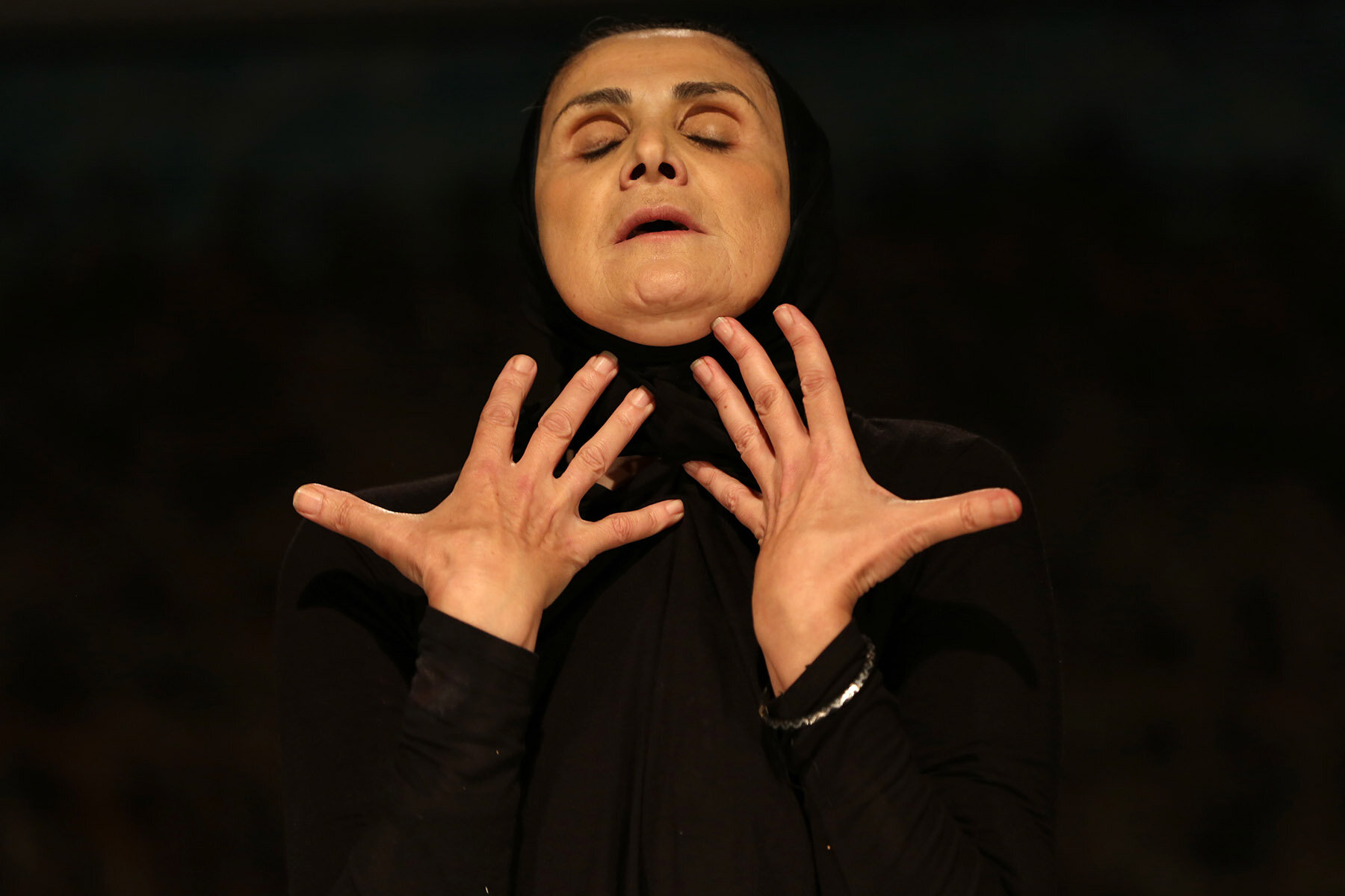 From Jogging: Theatre in Progress : Alone on an empty stage, Hanane — wife and mother — lifts the veil on her identity, becoming an